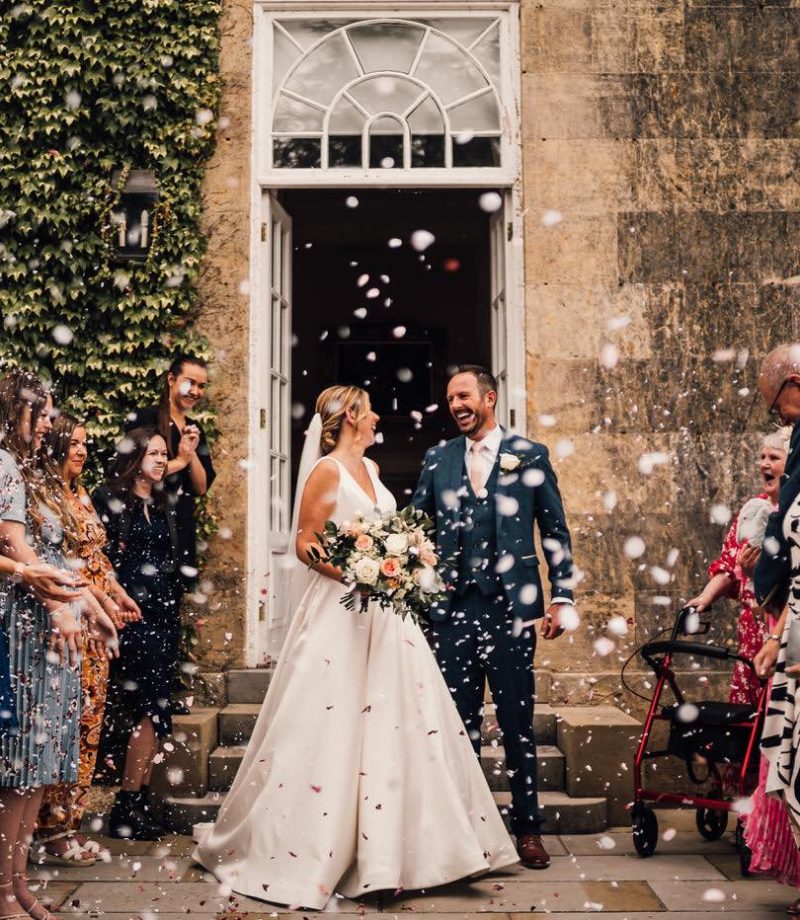 Confetti on the exit of the wedding ceremony by Bowcliffe Hall Wedding Photographer